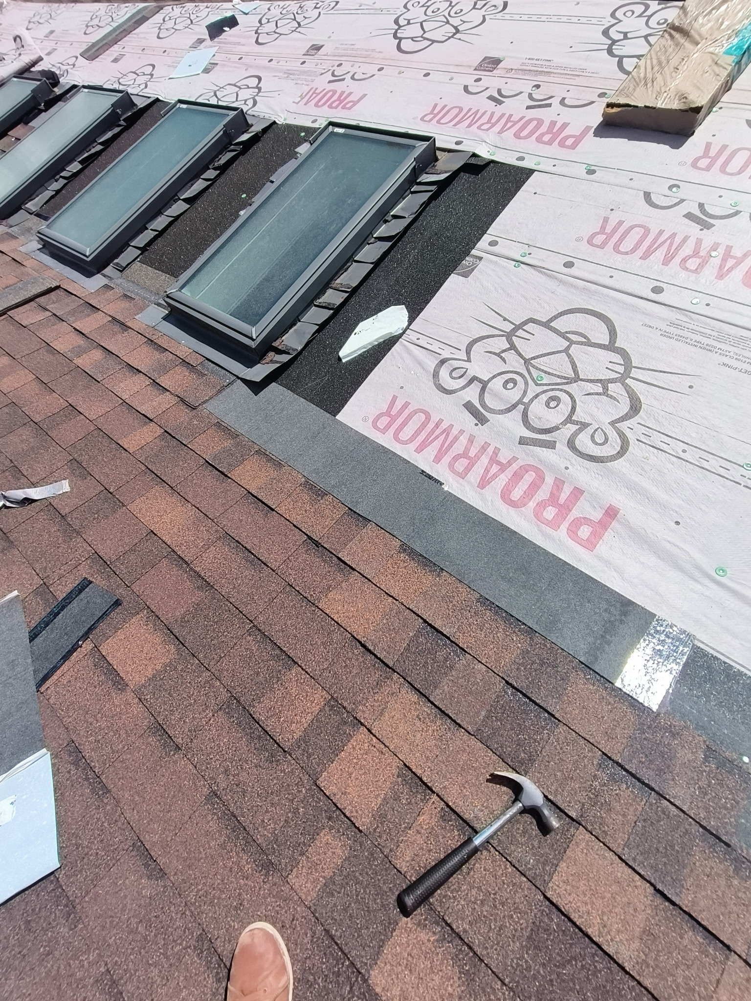 Roof installation in progress — ProArmor underlayment with skylights, Charlotte NC